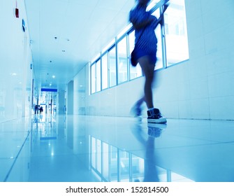 People Walking Through The Hospital Corridor. Blurred Motion