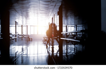 People Walking Through The Hospital Corridor.