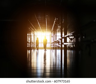 People Walking Through The Hospital Corridor. 