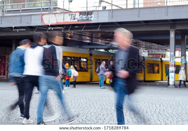 People walking\
and tram in Berlin city center\
