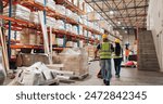 People, warehouse and storage for logistics with boxes, shelf and teamwork at global shipping company. Man, woman and back with trolley for package, distribution or supply chain in industrial factory