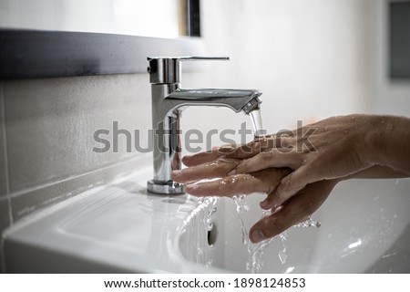 People washing their hands in the sink, washing their hands thoroughly is a precautionary measure against COVID-19 infection. Everyone washes their hands regularly in the right way.