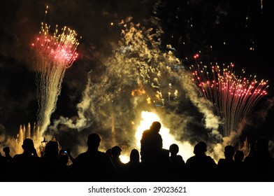 People watch a colorful fireworks show