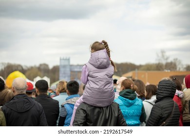 Lot Of People Watch Show On Street. People In City. Spectators Of Performance. City Festival. Lot Of People From Behind.