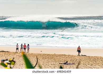 People Watch Surfer At Pipeline