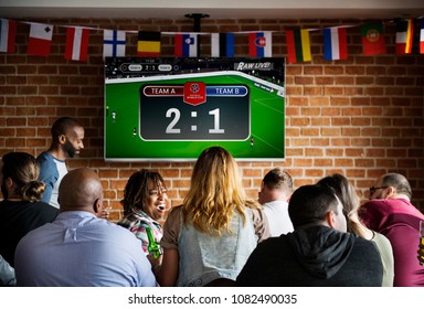 People Watching Football At A Sports Bar