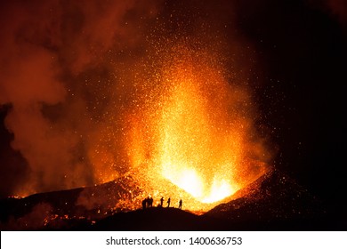 People Watching The Eyjafjallajökull Volcano Erupt On Iceland.