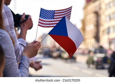 People Waving Czech And American Paper Flags In A Street - Celebration Of End Of WWII And Liberation Of Pilsen By USA