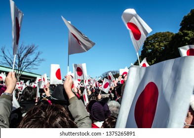 People Waving Japan Flags In Emperor Birthday Day At Imperial Palace In Tokyo