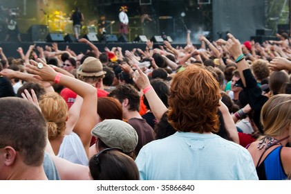 People Waving Their Hands At The Music Concert; Small Depth Of Field