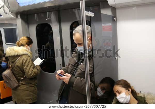 The people wearing disposable medical face mask\
in car of the subway in İstanbul during coronavirus outbreak.\
Safety in a public place while epidemic of covid-19.  14, 11, 2021.\
istanbul, Turkey\
