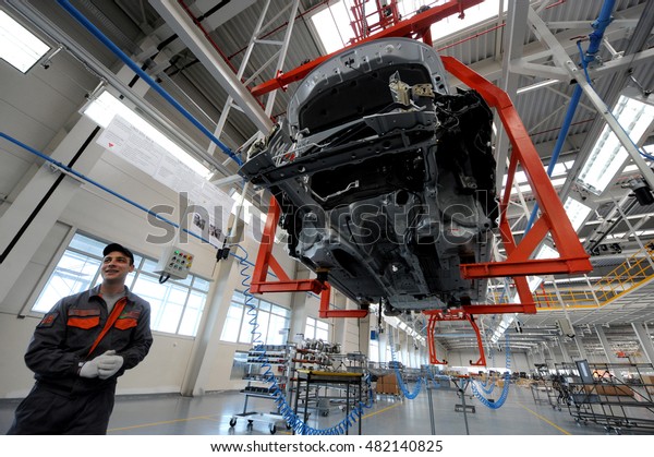 People work in the car factory in Lovech, Bulgaria,
February 21, 2012