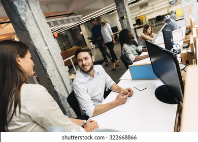 People Working At Busy Modern Office In Front Of Computers