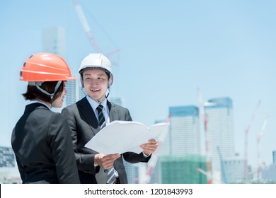 People Working In The Construction Industry (men And Women)