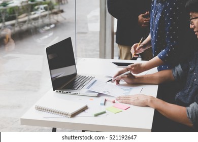 people working with document and laptop computer - meeting in office workplace concept