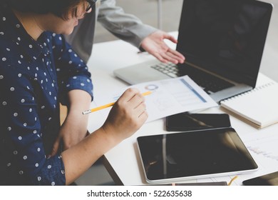 People Working With Document And Laptop Computer For Use As Office Workplace Concept