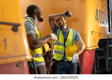 People working in heavy industry men at work happy workers laughing talking relax lunch break - Powered by Shutterstock