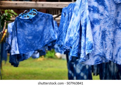 People Working Indigenous Knowledge Batik Dye Mauhom Color Process Dry Clothes In The Sun At Garden In Phrae, Thailand