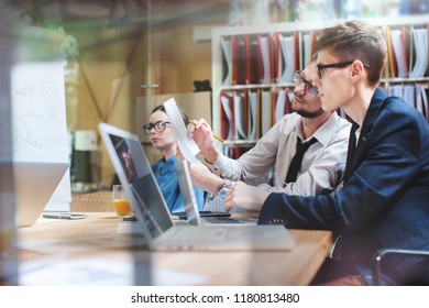 People Working In An Office At The Table Participating In Creative Sustainable Ideas In Modern Startup Office. Coworking.