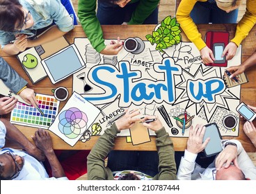 People Working with Photo Illustrations of Startup Business - Shutterstock ID 210787444