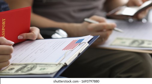 People write passport details in application form. Briefing before an interview at US Embassy. Payment consular fee. Receiving documents from consulate. Preparation for an interview at consulate - Shutterstock ID 1693797880