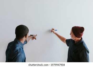 People Writing On A White Wall Mockup