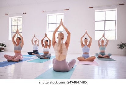 People, yoga class and instructor in stretching, fitness or wellness for mindful, wellbeing or health. Women, pose and studio for balance, gym and together in activity, training or spiritual practice - Powered by Shutterstock