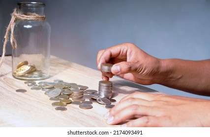 People's Hand Collecting Coins, Money Planning Concept, Budget Allocation And Planning. Valuation Of Investment.