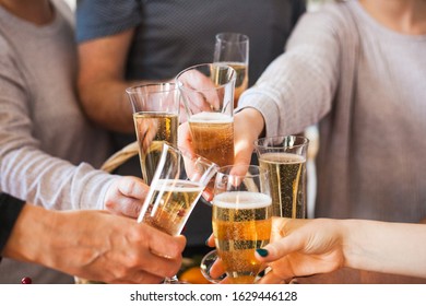 People's hands with glasses of champagne, celebrating a holiday, salute, holiday and birthday - Shutterstock ID 1629446128