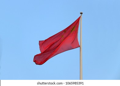 People's Republic of China, The flag of China, also known as the Five-star Red Flag, is a red field charged in the canton with five golden stars. Blown away by wind.