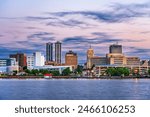 Peoria, Illinois, USA downtown skyline on the lake at dusk.