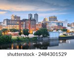 Peoria, Illinois, USA downtown skyline on the lake at dusk.