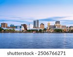 Peoria, Illinois, USA downtown skyline on the lake at dusk.