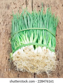 Pepole Welsh Onions On Old Wood