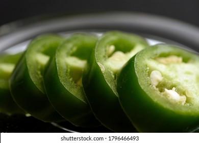 Jalapeño Pepper Cut Into Slices And Placed On A Transparent Glass Plate