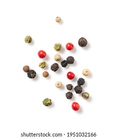 Pepper mix. Black, red, white, and green peppercorns on a white background. View from directly above.