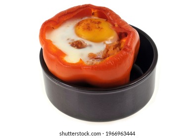 Pepper Stuffed With A Fried Egg Served In A Ramekin On A White Background 