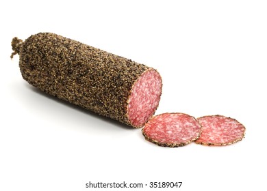 Peppered Salami Sausage With Slices Isolated On White