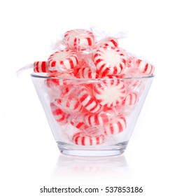 Peppermint Candy In Glass Bowl Isolated On White.