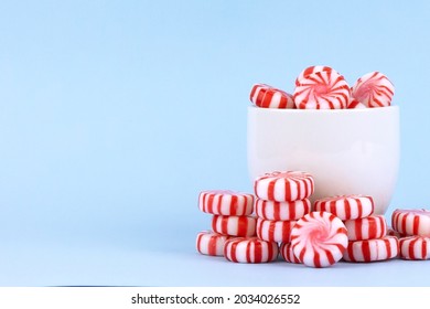 Peppermint Candy. Red And White Swirls. Blue Background