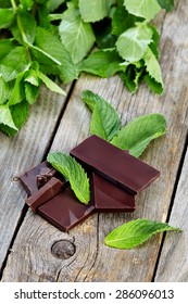 Peppermint With Chocolate On Wooden Table