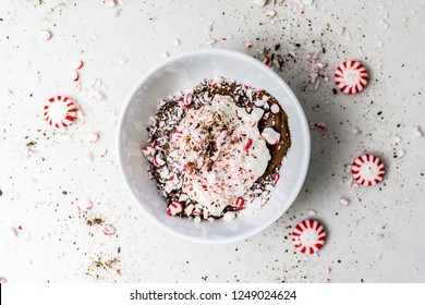 Peppermint Mocha Mousse With Whipped Cream And Crumbled / Crushed Peppermint Candies, Top View. Chocolate, Coffee And Mint Dessert & Sweet Treat. White Bowl. 