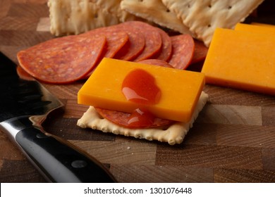 Pepperoni Cheese Crackers And Hot Sauce