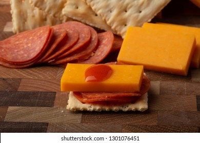 Pepperoni Cheese Crackers And Hot Sauce