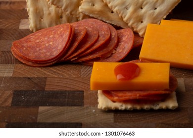 Pepperoni Cheese Crackers And Hot Sauce