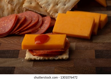 Pepperoni Cheese Crackers And Hot Sauce