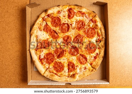 Pepperoni pizza in a box