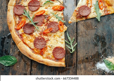 Pepperoni pizza with chili and arugula - Powered by Shutterstock