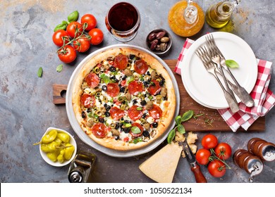 Pepperoni Pizza With Olives On The Table Overhead View
