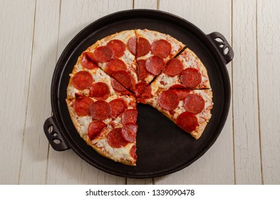 Pepperoni Pizza On A Cast Iron Pan